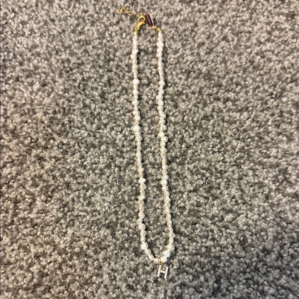 Elegant Pearl Necklace with “H” initial and Gold Accents